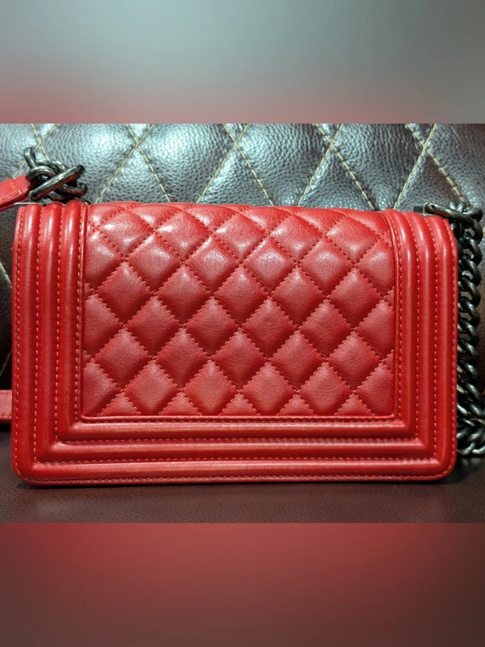 CHANEL Red leather small Boy with gunmetal tone chain